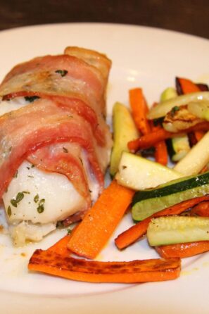 sea bass wrapped in bacon baked