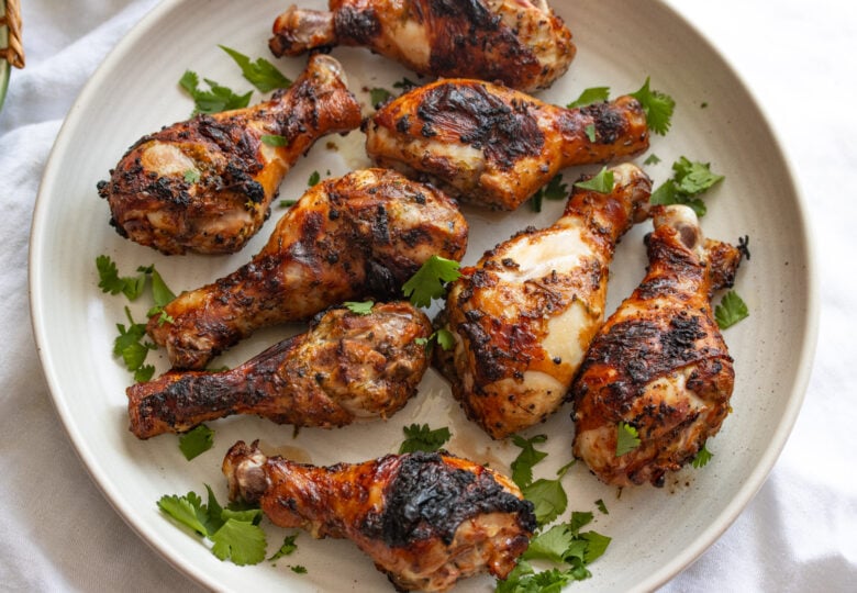 cilantro lime chicken drumstick on a white serving plate