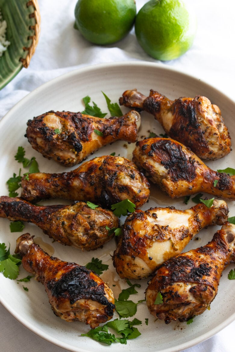 cilantro lime chicken drumstick on a white serving plate