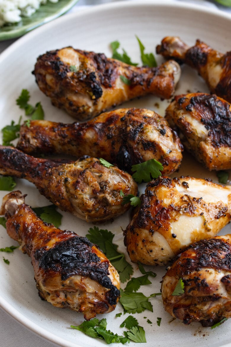 cilantro lime chicken drumstick on a white serving plate