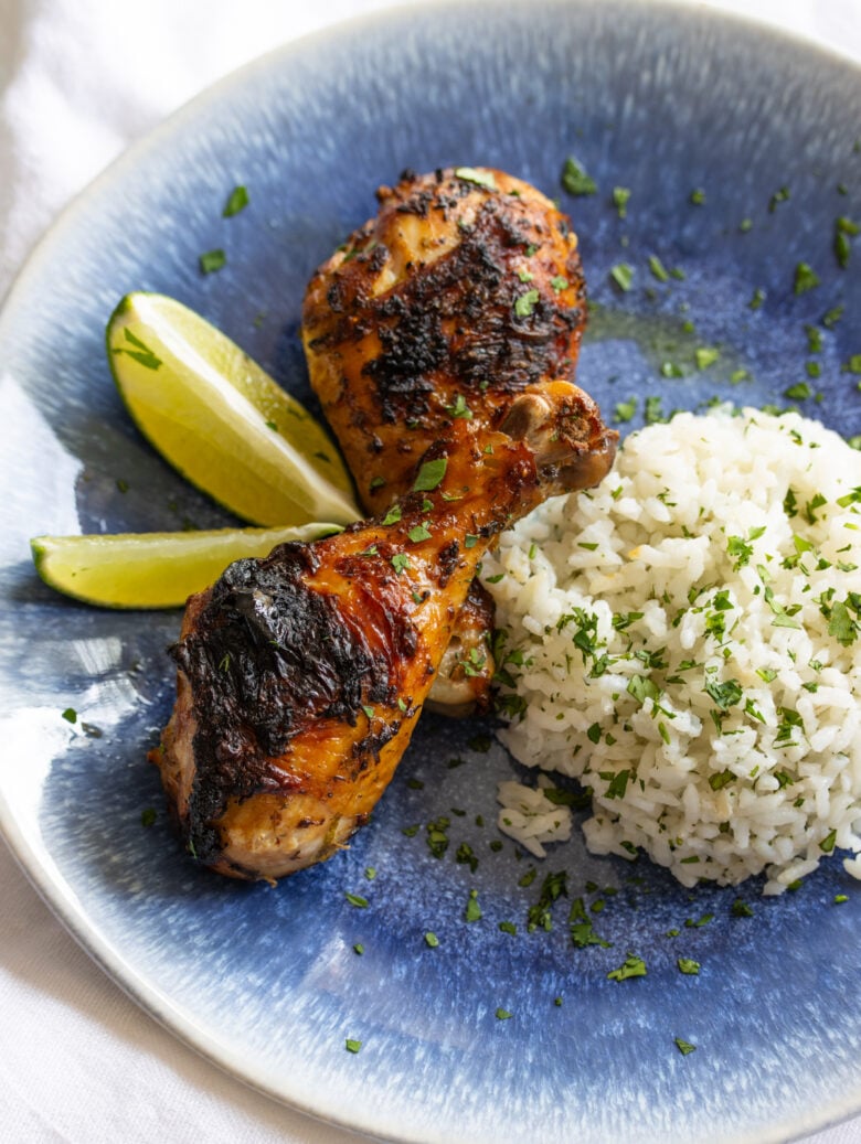 on a blue plate with rice and Cilantro Lime Chicken drumstick