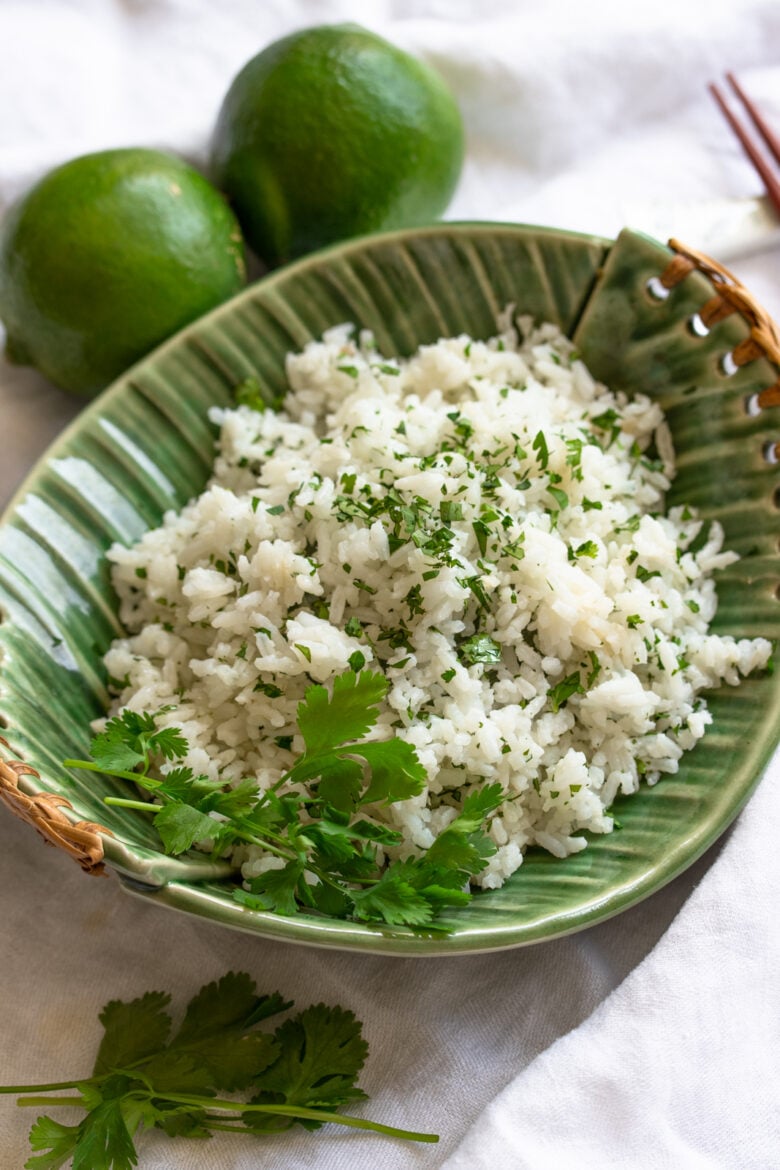 limes, rice in a green dish