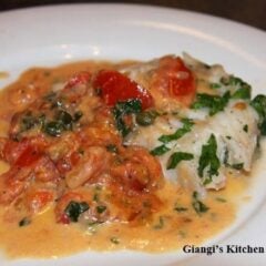 Fillets of cod with artichokes hearts, tomatoes and green olives