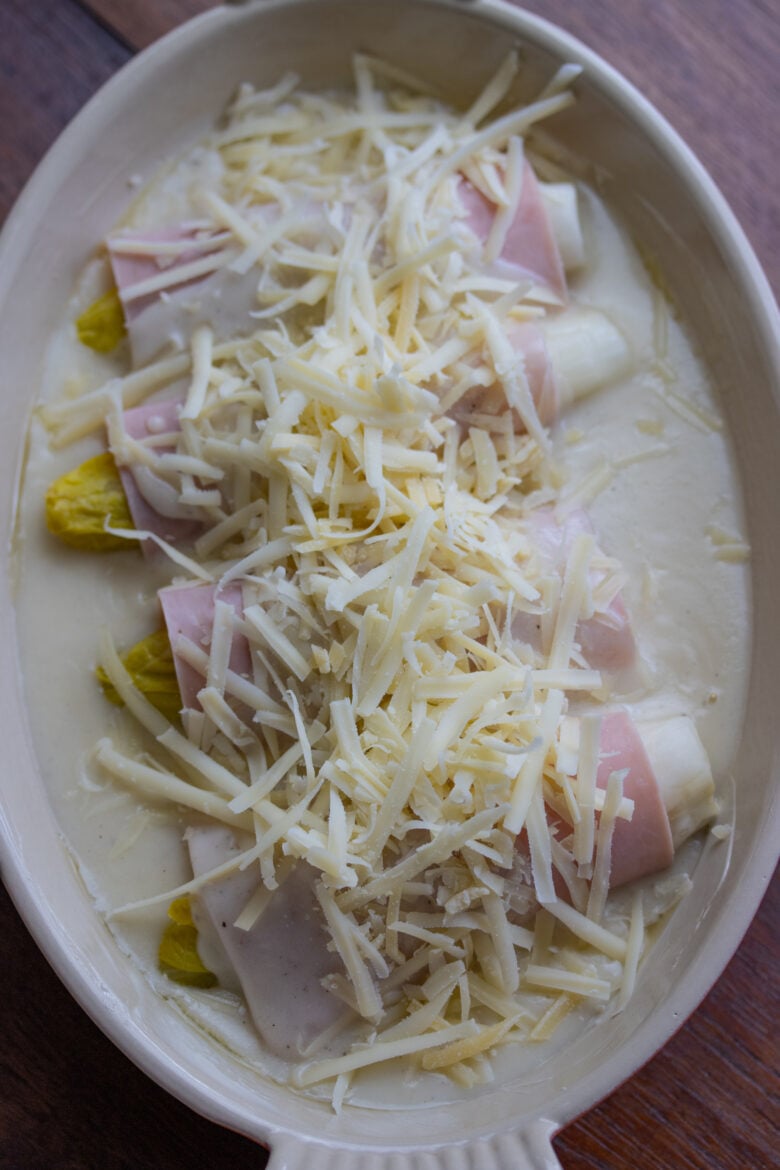 Endive Ham Gratin in a greating dish with bechamel and cheese over them