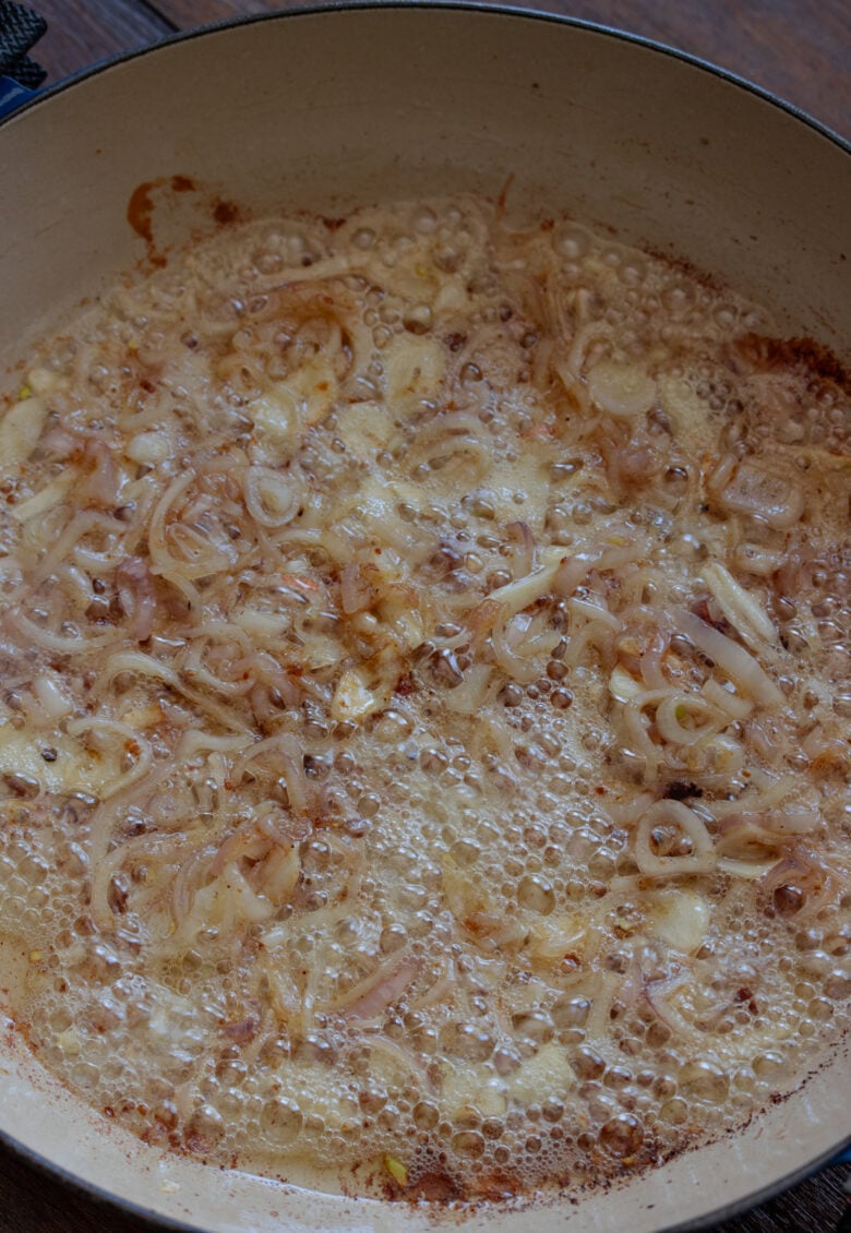 shallots and garlic sauteeing in the large skillet