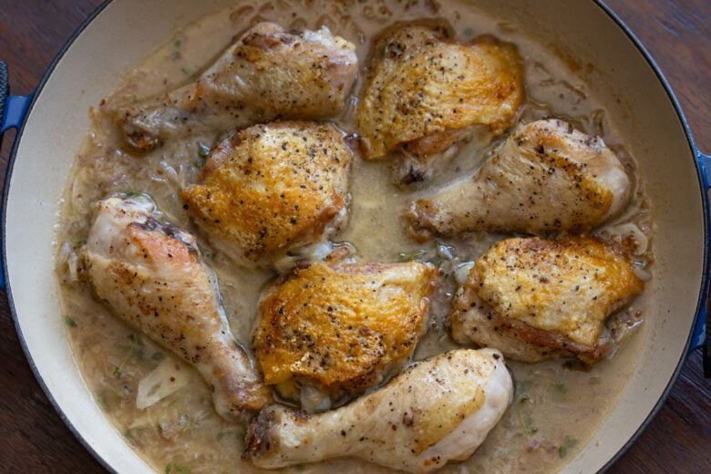 wine and chicken drumsticks and thighs ready to go in the oven