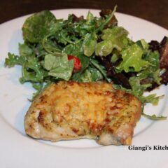 Pecorino crusted chicken with arugula and mixed baby green salad