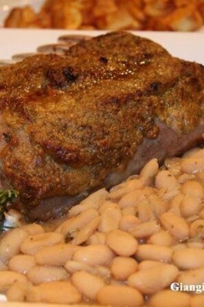 Herbs rack of lamb with white beans and rosemary ragout