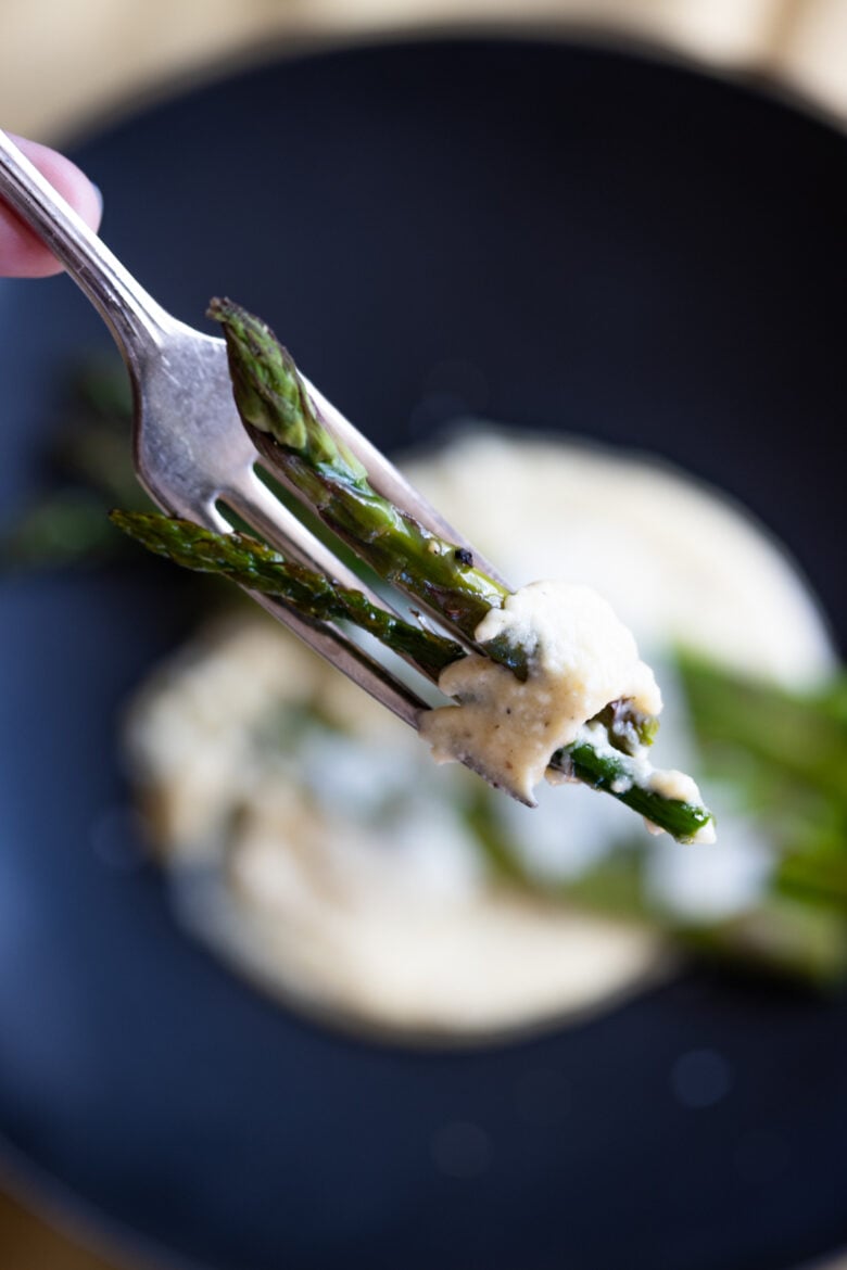 close up of Roasted Asparagus with Parmesan Cream Sauce