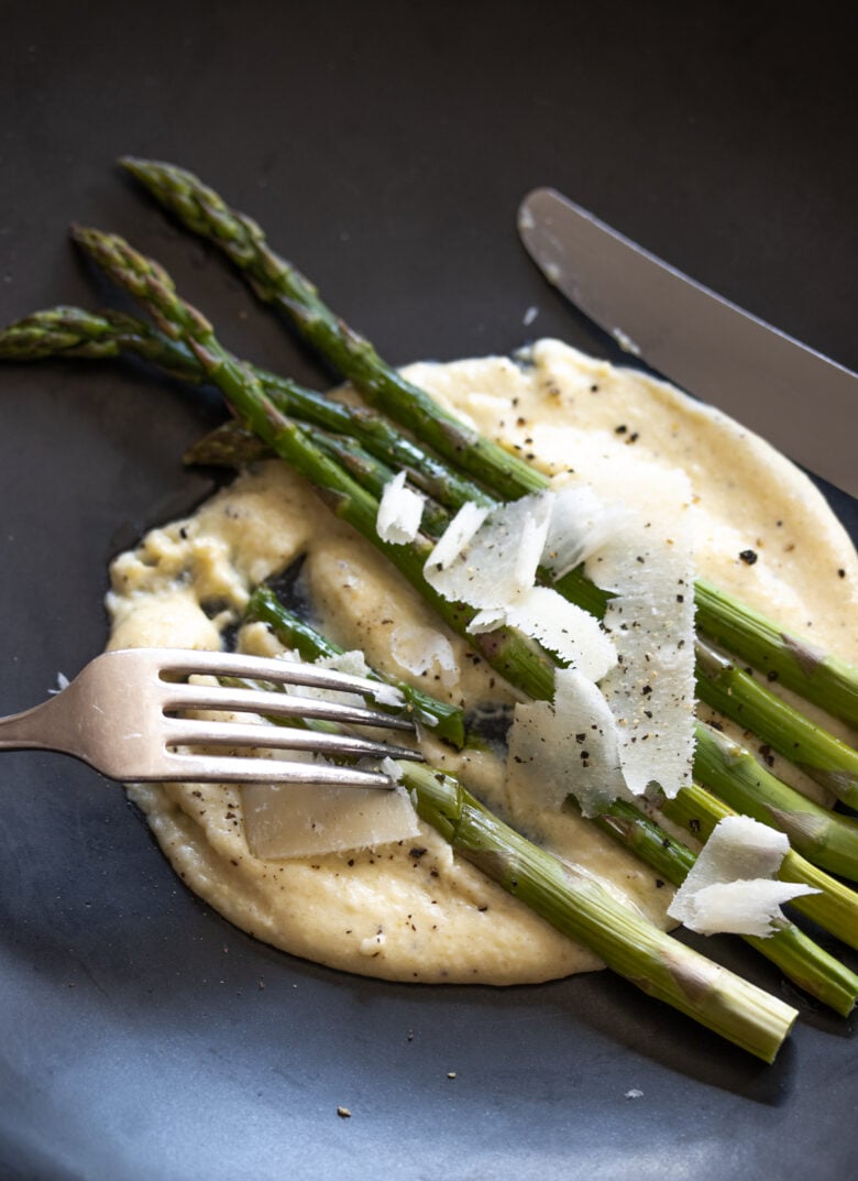 clvose up with silverware of the Roasted Asparagus with Parmesan Cream Sauce