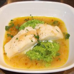 lemon soup with pea puree and sea bass