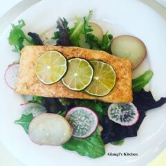 Salmon fillets with baby greens and arugual salad