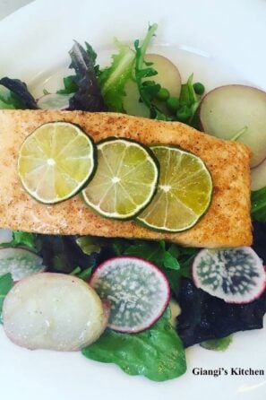 Salmon fillets with baby greens and arugual salad