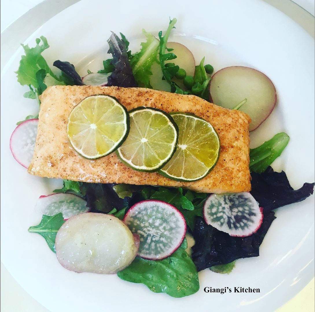 Salmon fillets with baby greens and arugual salad