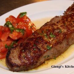 Steak with tomato salad