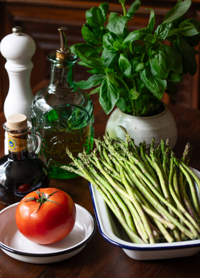 ingredients needed to make the recipe: asparagus, tomato, basil, balsamic vinegar, olive oil and basil