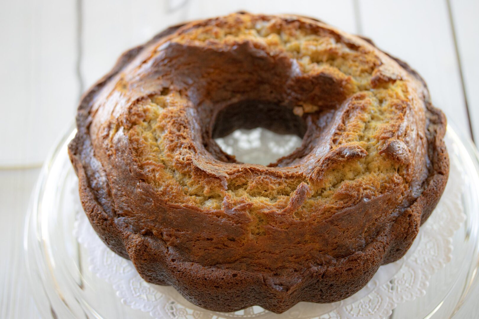 banana cake on a stnd with white background