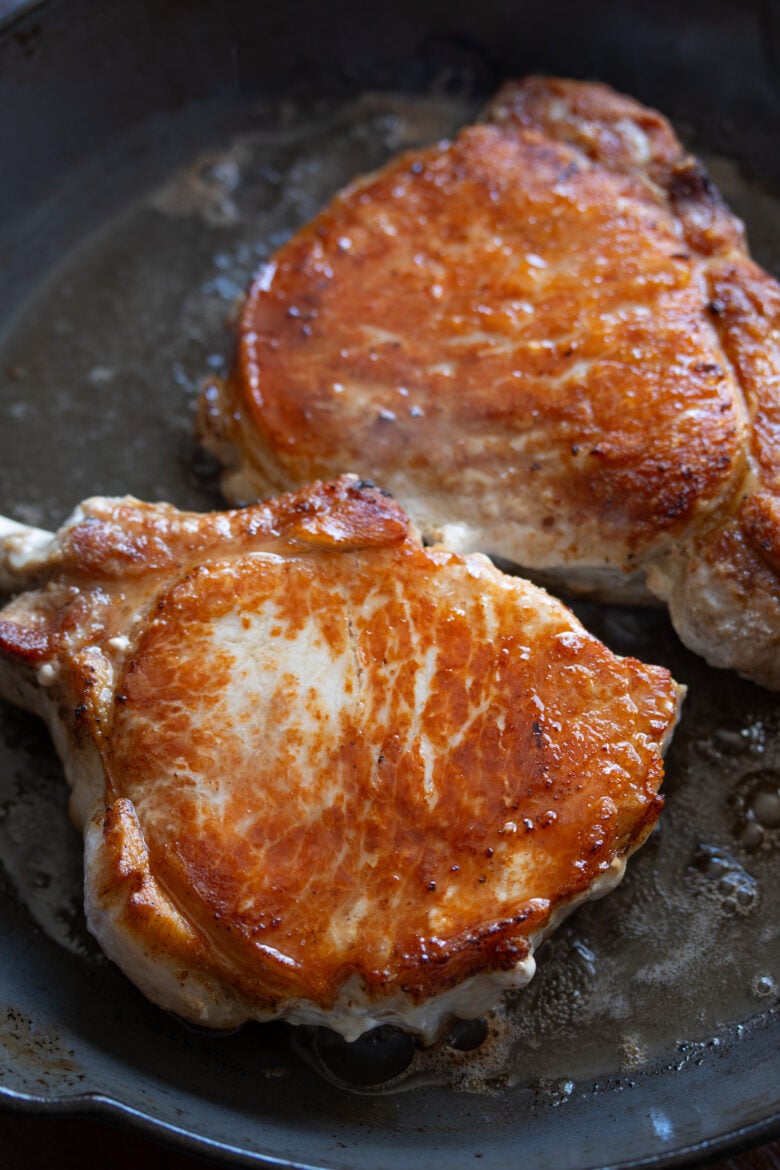 Bone in pork chops with cheese sauce