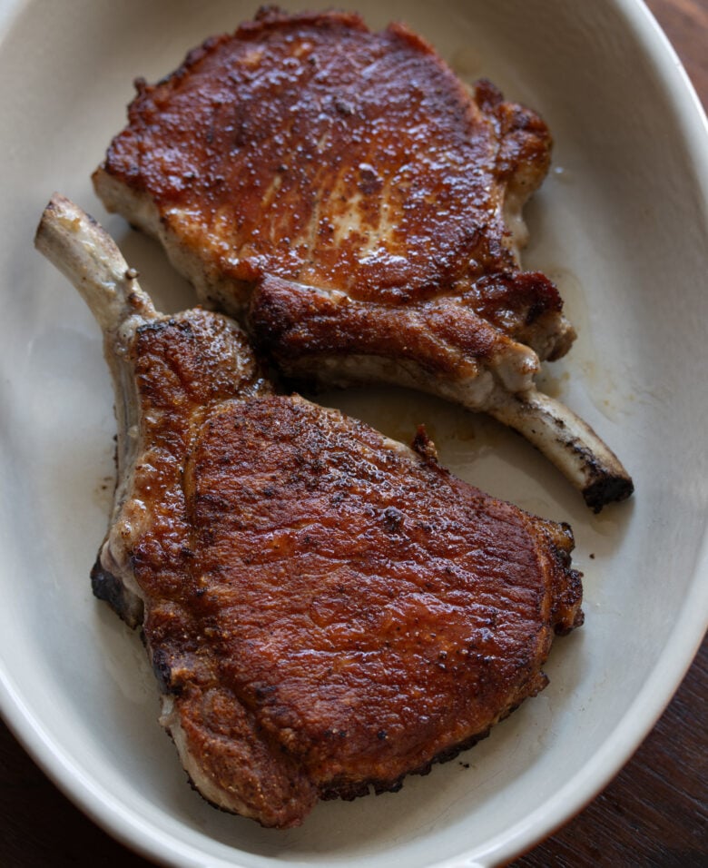 Bone in pork chops with cheese sauce