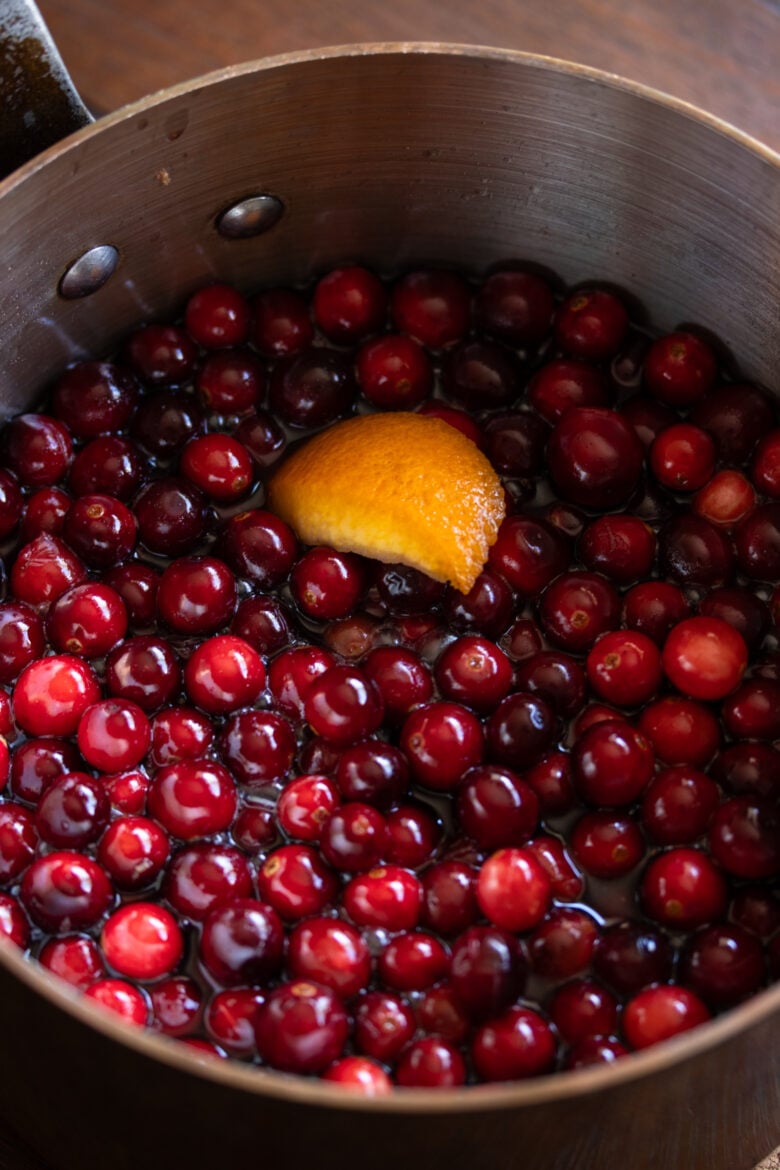 cranberry chutney with pinot noir in pan with orange zest