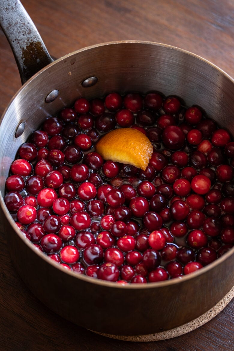 preparing the chutney with red wine in pan and with orange zest