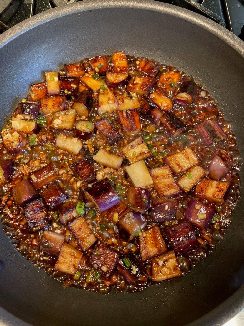 Chinese Eggplant cooking in a wok