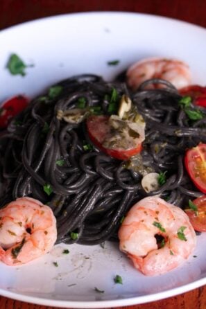 ink pasta with shrimps, tomatoes and garlic