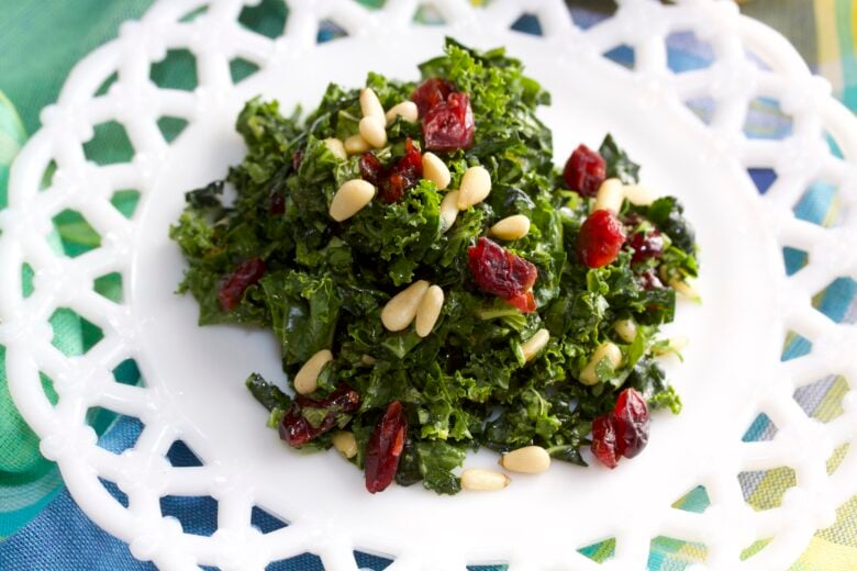 kale salad finished on a while plate