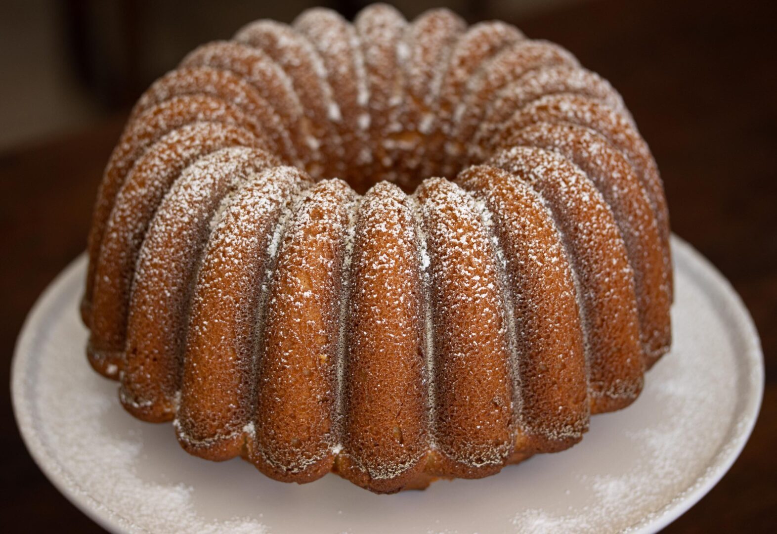 lemon pound cake unmolded on a white plate