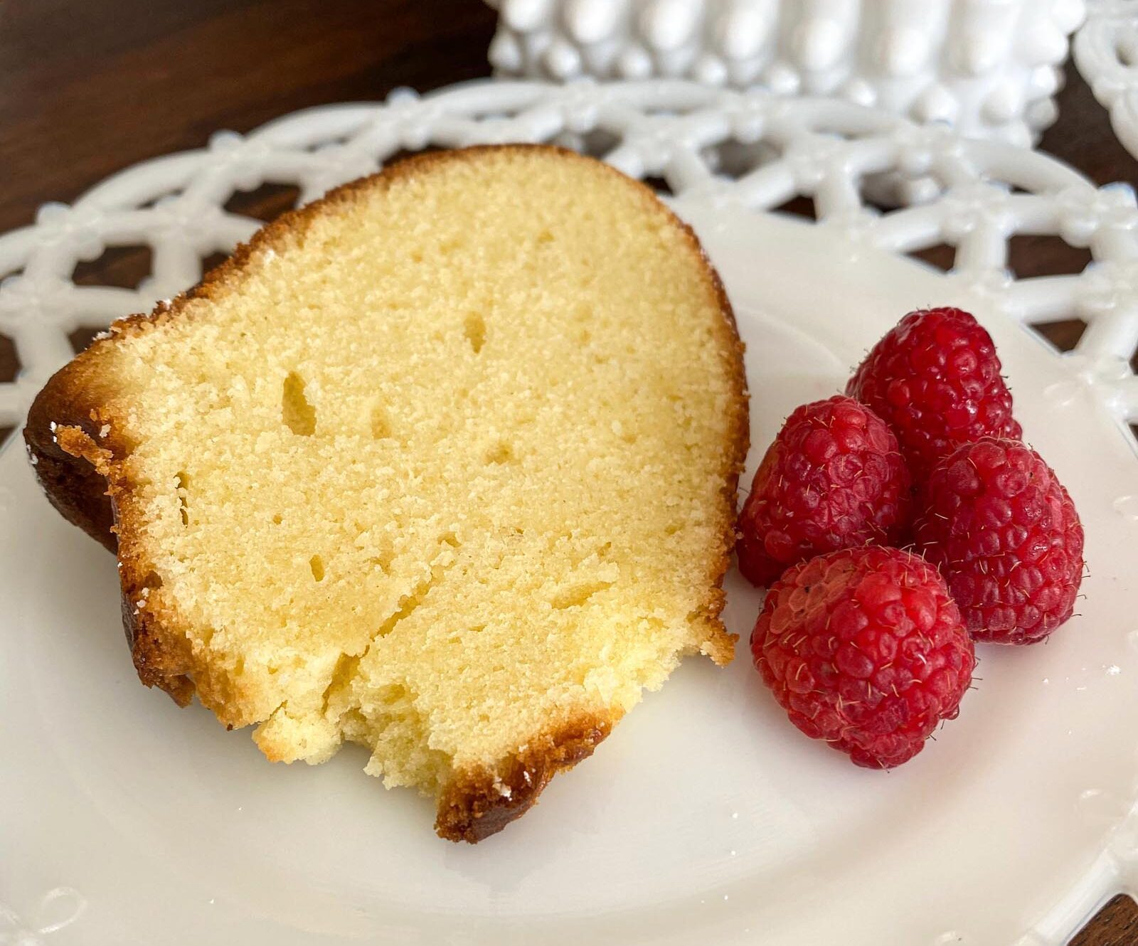 lemon pound cake sliced and served with raspberries