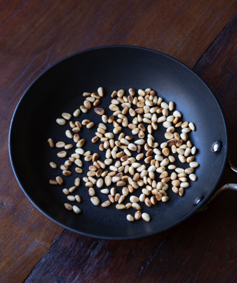 pine nuts in a small skillet