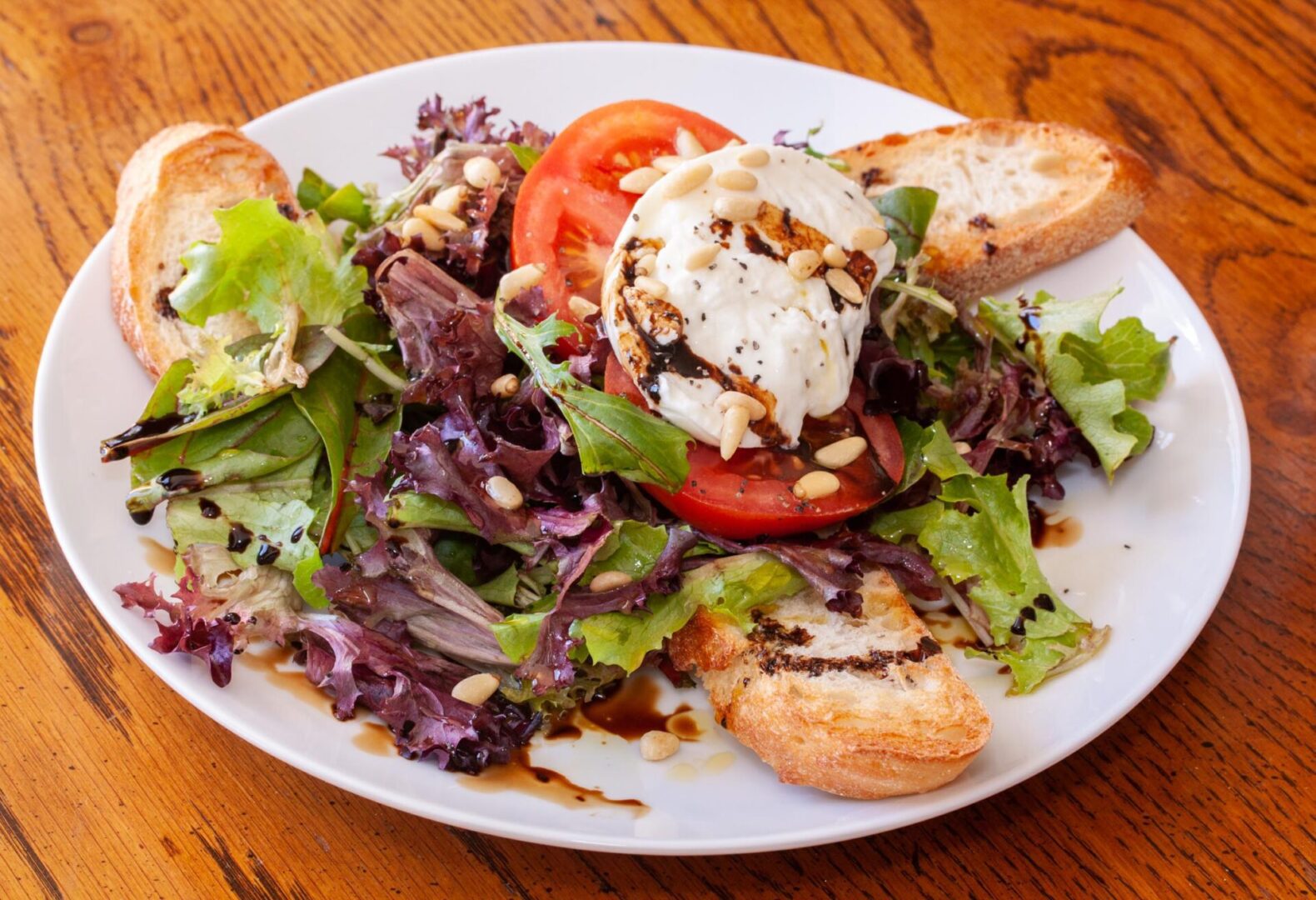 panzanella caprese salad on a white serving plate