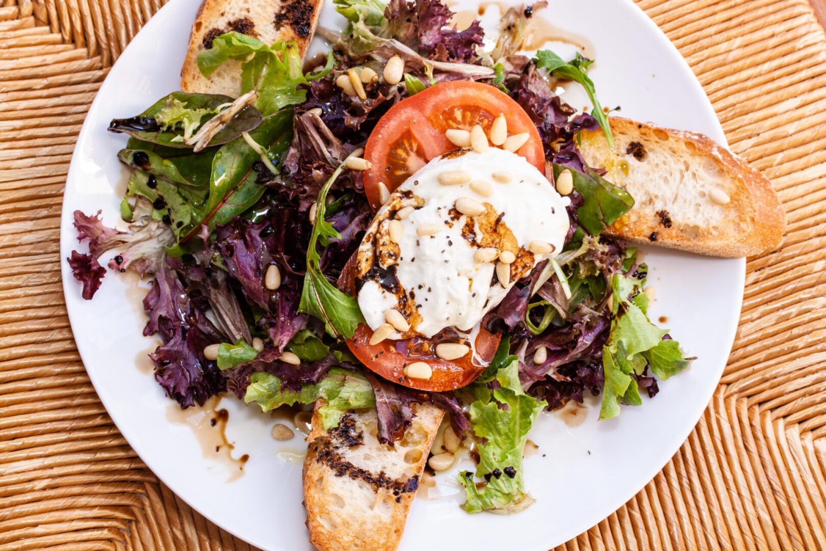 panzanella caprese salad on a white serving plate