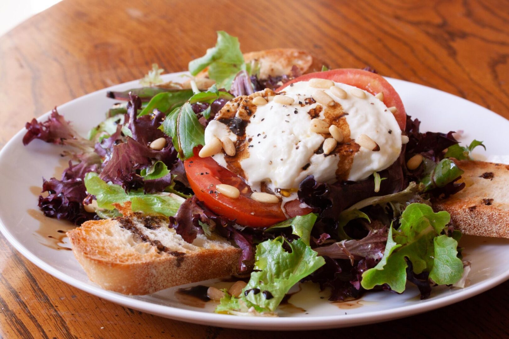 panzanella caprese salad on a white serving plate