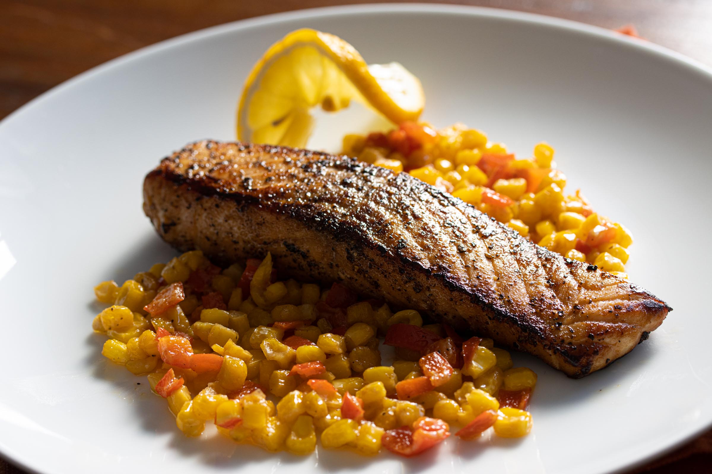 Pepper Crust Salmon With Creamed Corn And Bell Peppers