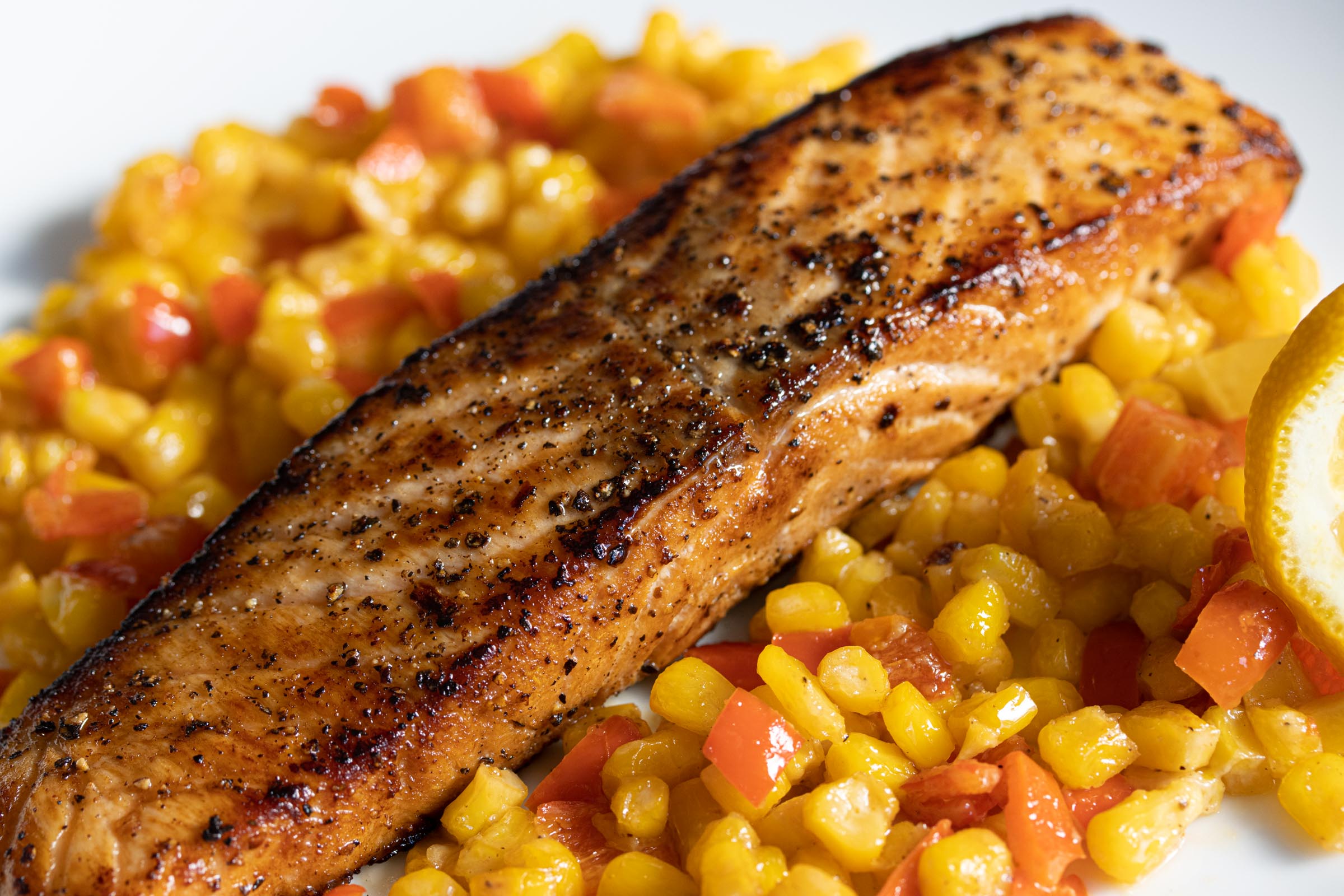 Pepper Crust Salmon With Creamed Corn And Bell Peppers