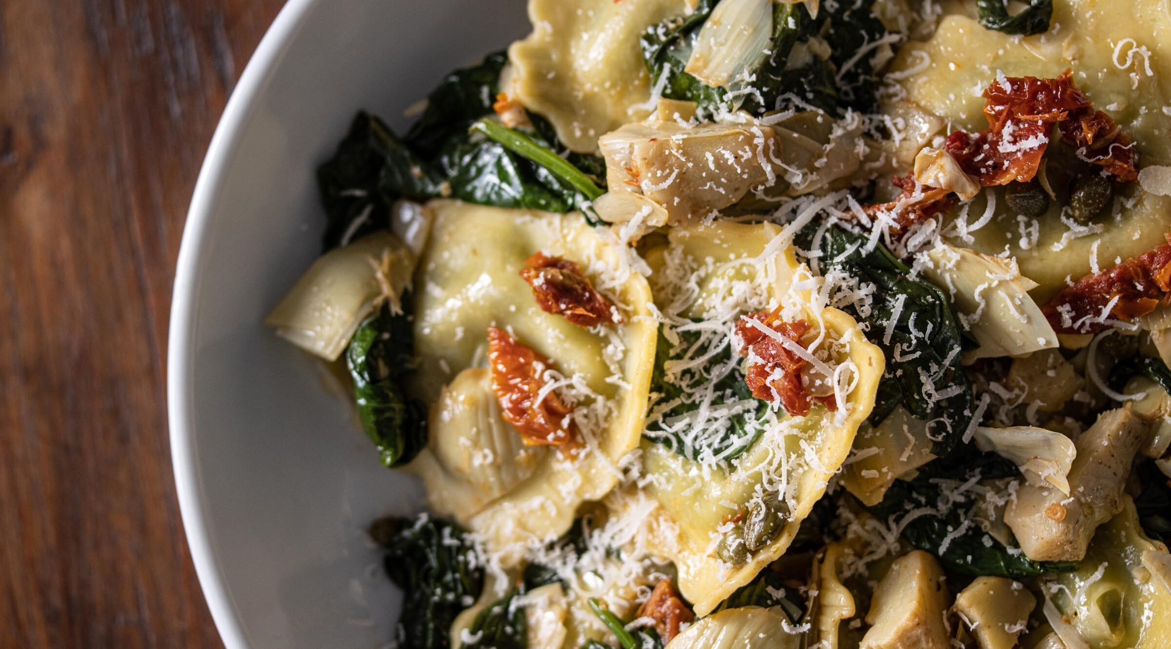 ravioli with asparagus hearts, capers, sun-dried tomatoes, spinach