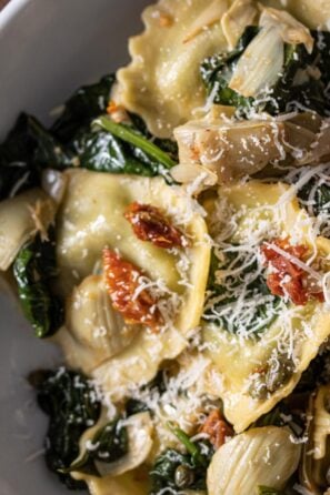 ravioli with asparagus hearts, capers, sun-dried tomatoes, spinach