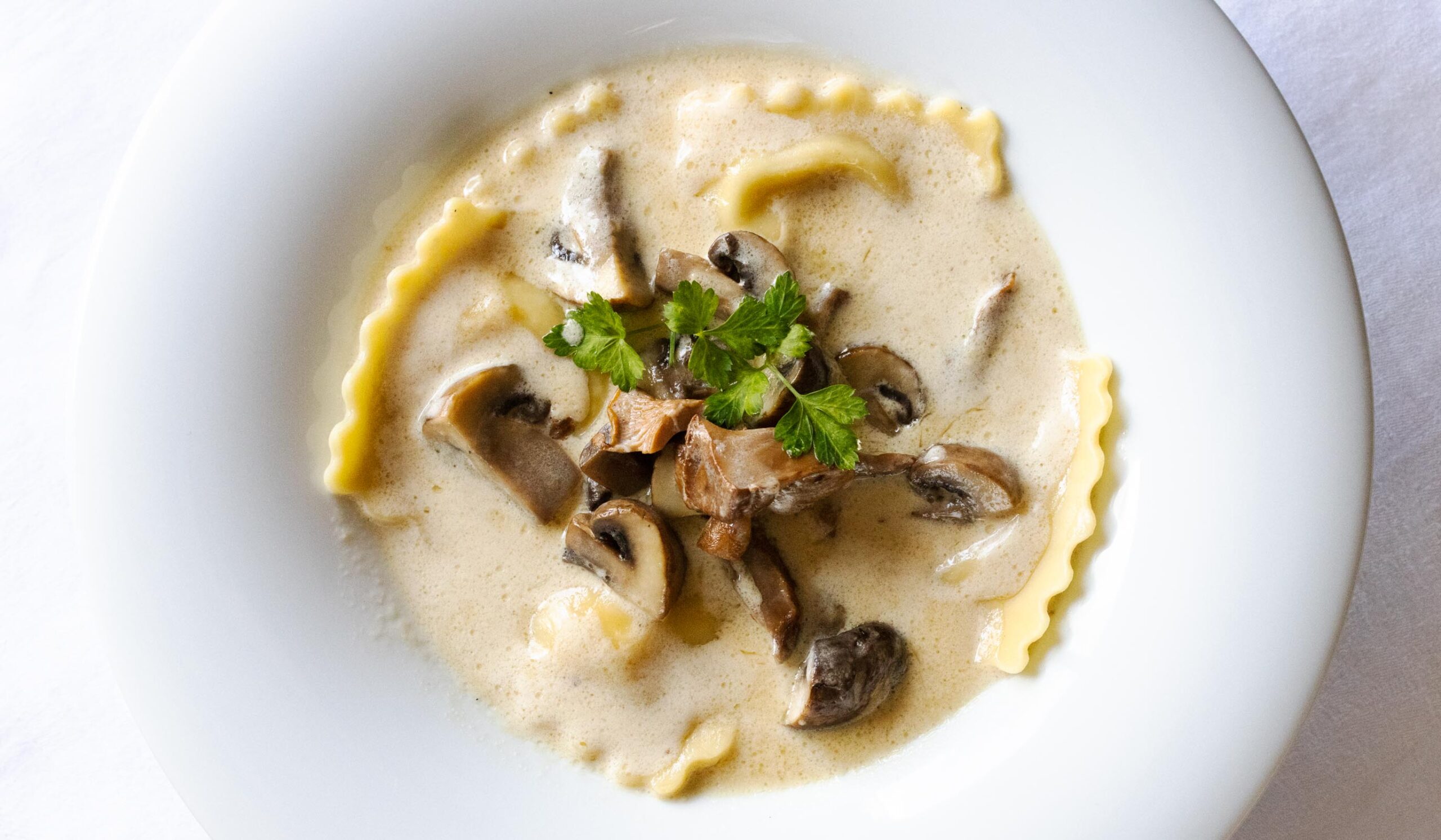 Ravioli with mushrooms and cream