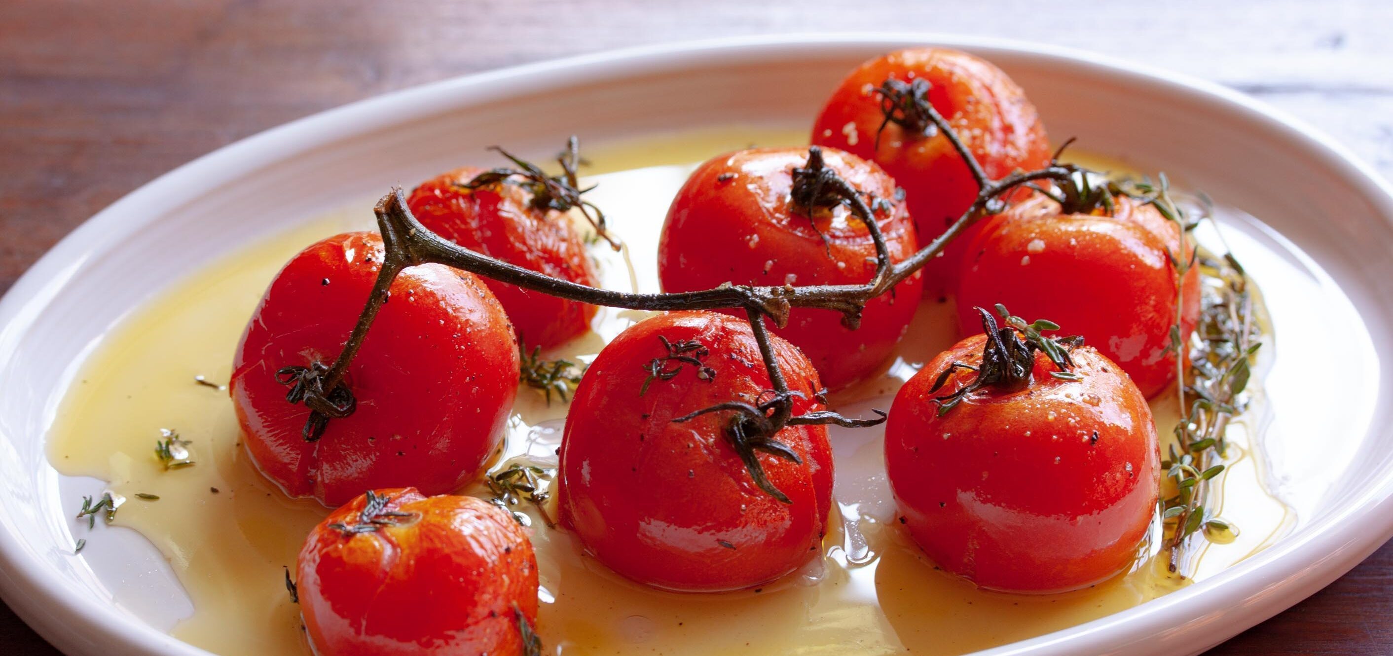 roasted tomatoes in a serving plate