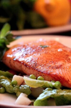 Seared salmon with peas, potatoes and mint.