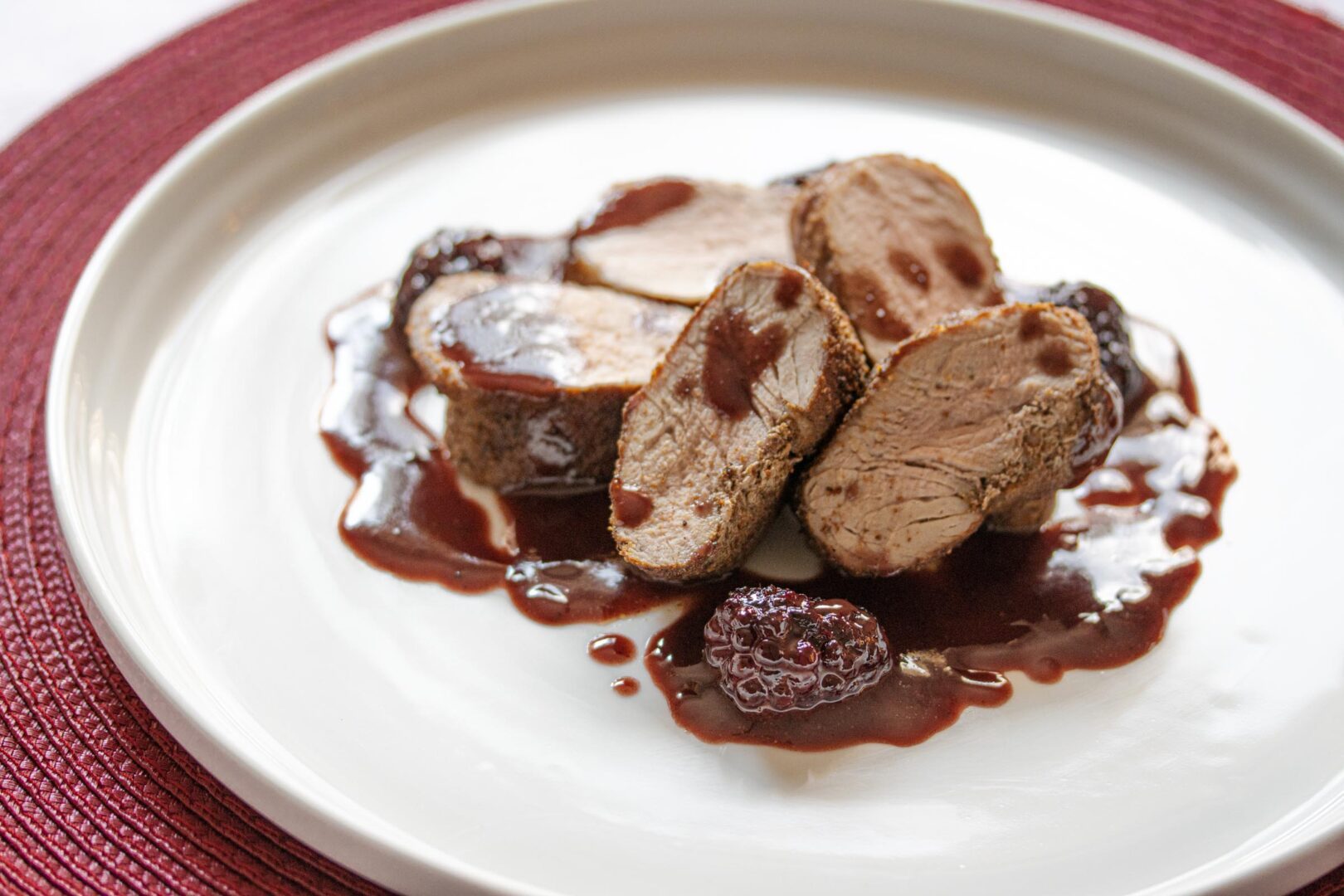 pomegranate, blackberries sauce with pork tenderloin