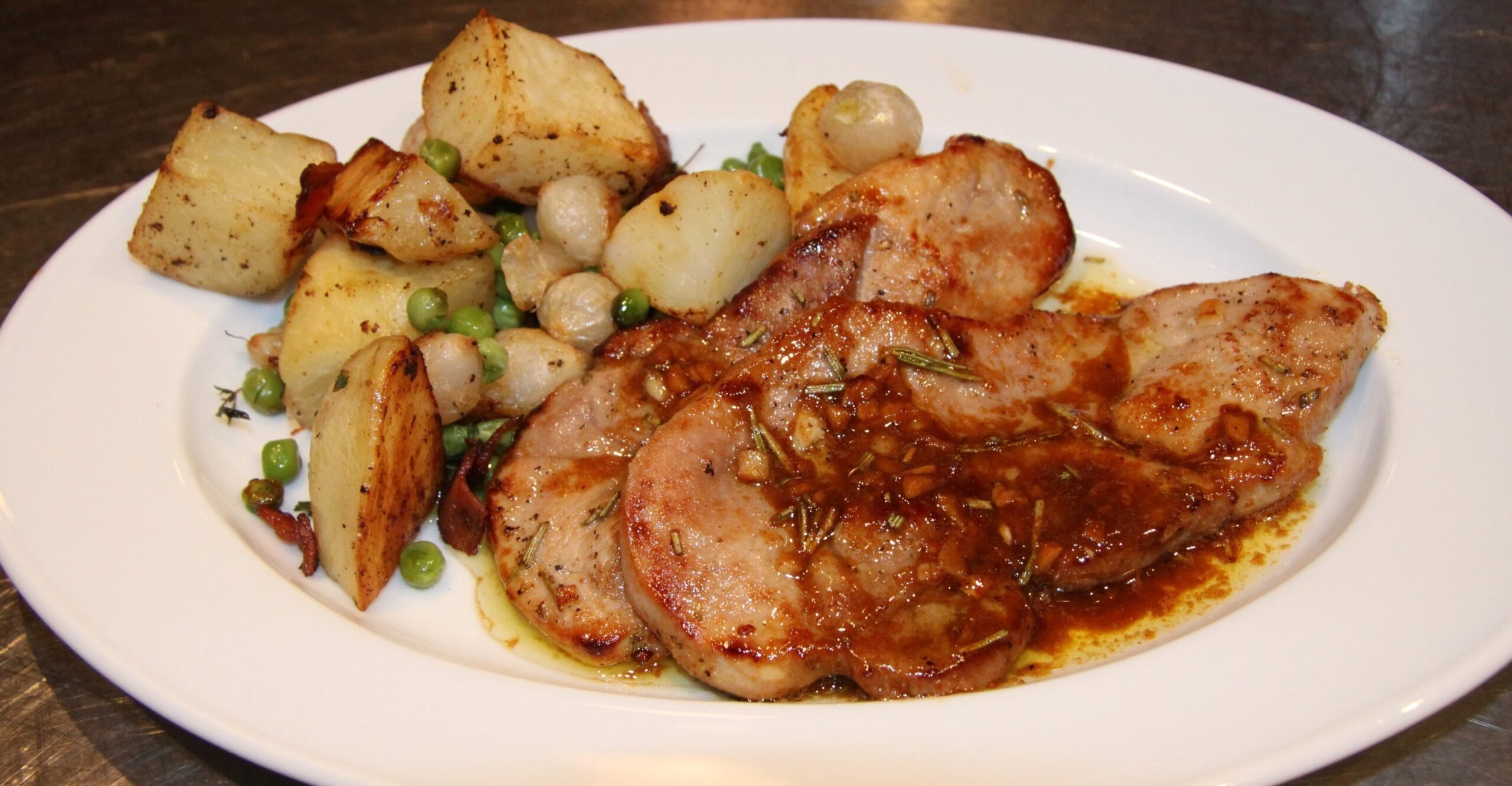 white balsamic pork chops with roasted potaotes and peas