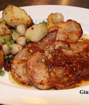 white balsamic pork chops with roasted potatoes and peas