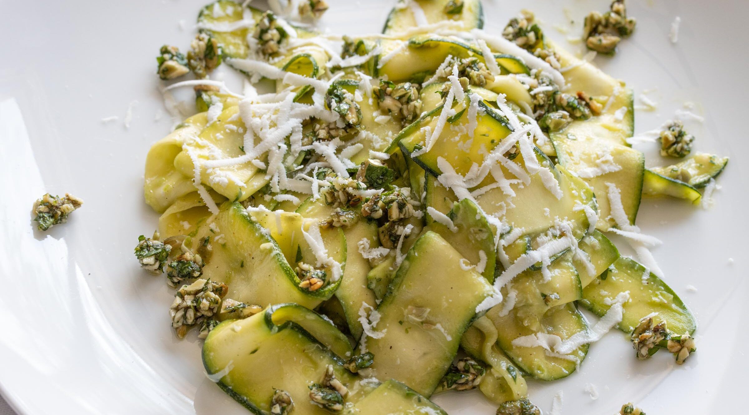 zucchini salad with avocado, pepita parsley gremolata